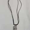 Metallic medal with leather cord