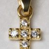 Gold cross with precious stones